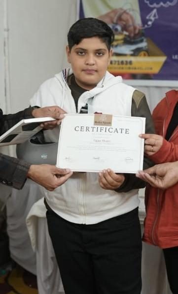 Yajas receiving a certificate at an Esdar program